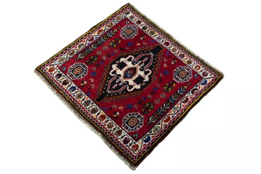 Corner detail of 2000s Shiraz rug showing border pattern and Wool pile