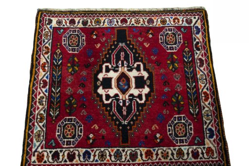 Surface texture of 2000s Shiraz rug with natural Wool and intricate pattern