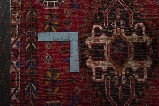 Backside of handmade 2000s Shiraz rug showing knot structure and weave density
