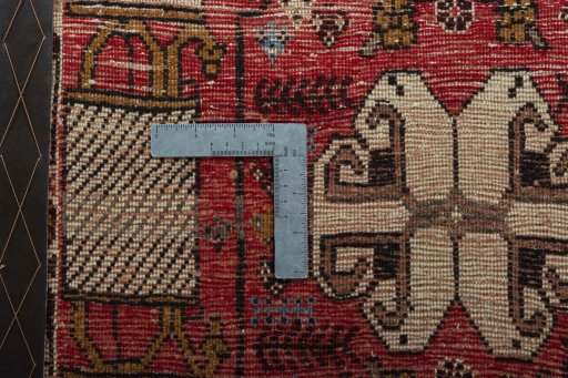 Backside of handmade 2000s Shiraz rug showing knot structure and weave density