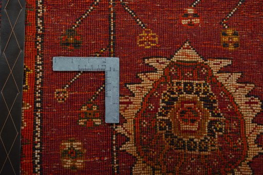 Backside of handmade 2000s Shiraz rug showing knot structure and weave density