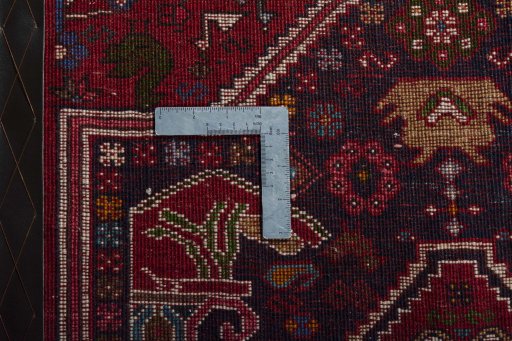 Corner detail of 2000s Shiraz rug showing border pattern and Wool pile
