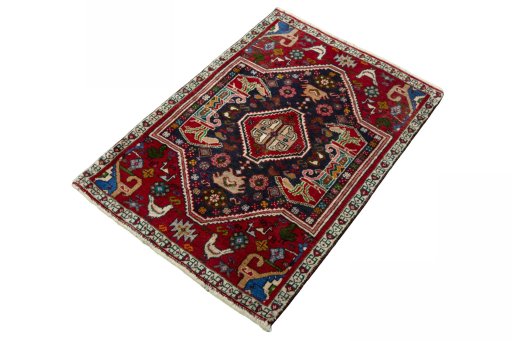 Corner detail of 2000s Shiraz rug showing border pattern and Wool pile