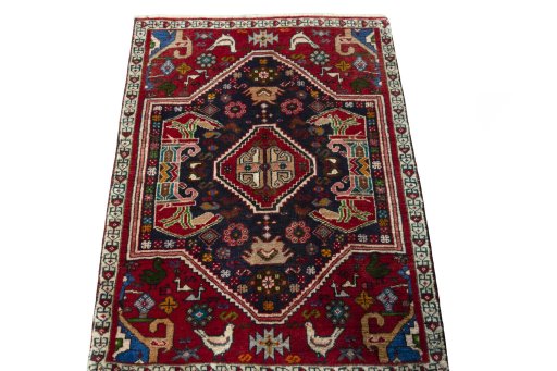 Surface texture of 2000s Shiraz rug with natural Wool and intricate pattern