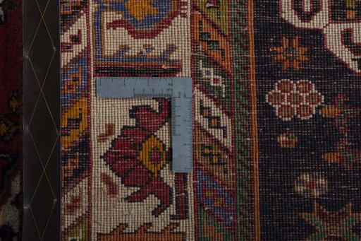 Backside of handmade 1970s Shiraz rug showing knot structure and weave density