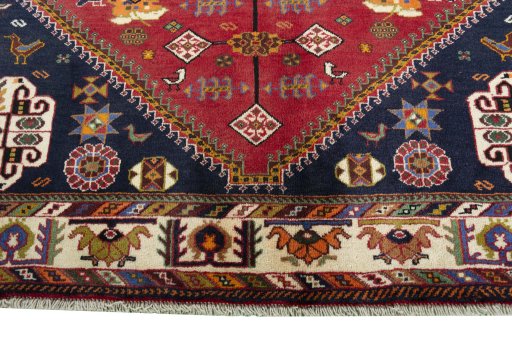 Full view of 1970s Shiraz rug from Iran / Persia, 288 × 197 cm in Red tones