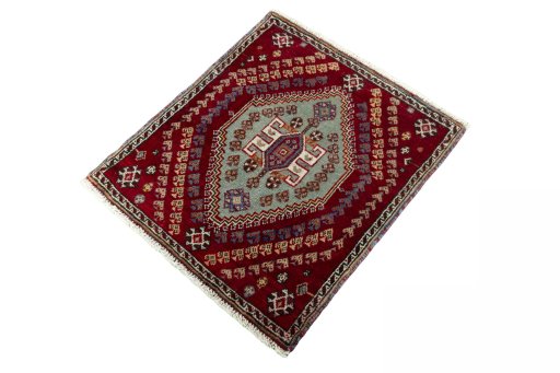 Corner detail of 2000s Shiraz rug showing border pattern and Wool pile