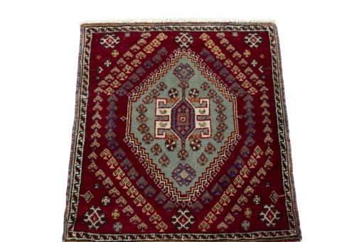 Surface texture of 2000s Shiraz rug with natural Wool and intricate pattern