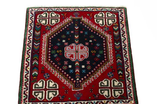 Surface texture of 2000s Shiraz rug with natural Wool and intricate pattern
