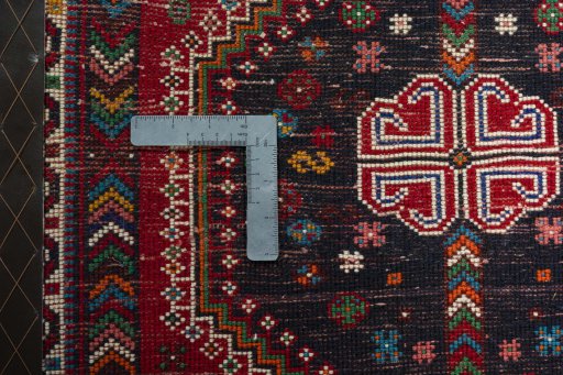 Backside of handmade 2000s Shiraz rug showing knot structure and weave density