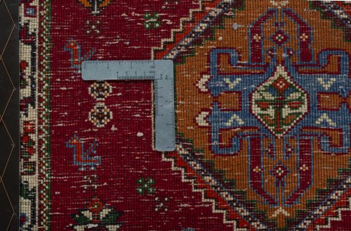 Backside of handmade 2000s Shiraz rug showing knot structure and weave density
