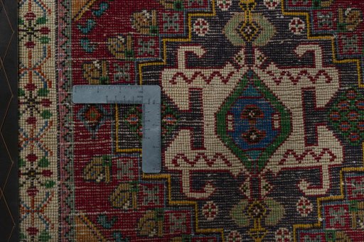 Backside of handmade 2000s Shiraz rug showing knot structure and weave density