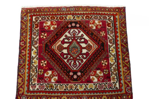 Surface texture of 2000s Shiraz rug with natural Wool and intricate pattern