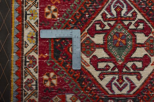 Backside of handmade 2000s Shiraz rug showing knot structure and weave density