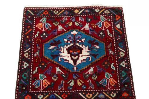 Surface texture of 2000s Shiraz rug with natural Wool and intricate pattern