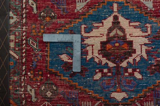 Backside of handmade 2000s Shiraz rug showing knot structure and weave density