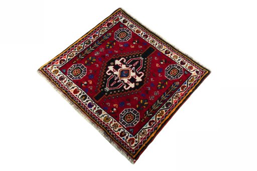 Corner detail of 2000s Shiraz rug showing border pattern and Wool pile