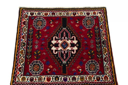 Surface texture of 2000s Shiraz rug with natural Wool and intricate pattern