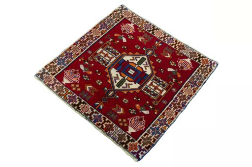 Corner detail of 2000s Shiraz rug showing border pattern and Wool pile
