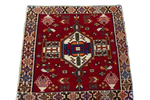 Surface texture of 2000s Shiraz rug with natural Wool and intricate pattern