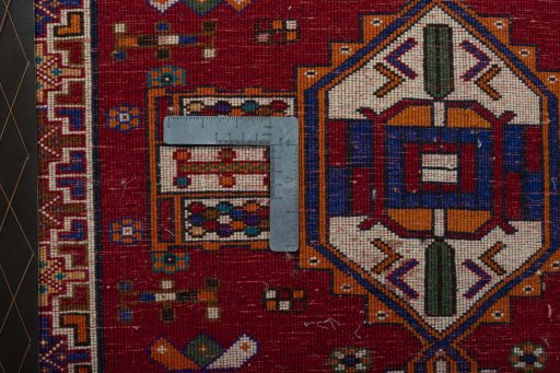 Backside of handmade 2000s Shiraz rug showing knot structure and weave density