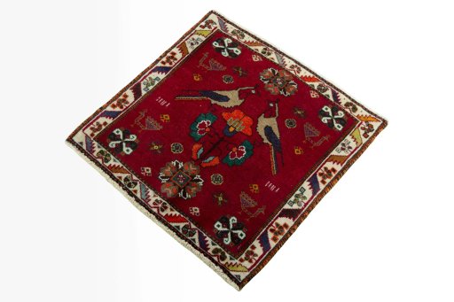 Corner detail of 2000s Shiraz rug showing border pattern and Wool pile