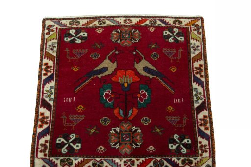 Surface texture of 2000s Shiraz rug with natural Wool and intricate pattern