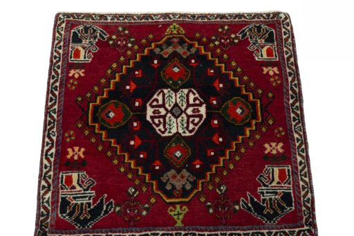 Surface texture of 2000s Shiraz rug with natural Wool and intricate pattern