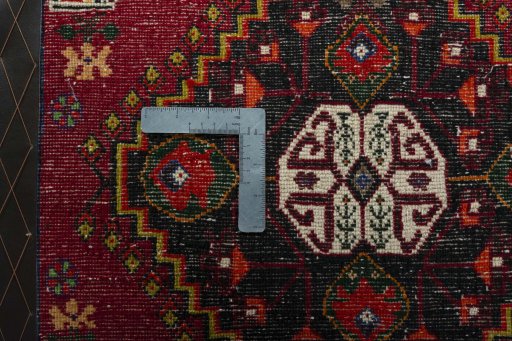 Backside of handmade 2000s Shiraz rug showing knot structure and weave density