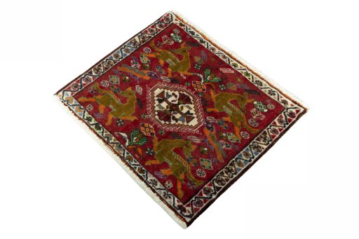 Corner detail of 2000s Shiraz rug showing border pattern and Wool pile