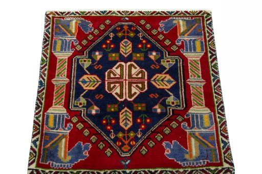 Surface texture of 2000s Shiraz rug with natural Wool and intricate pattern