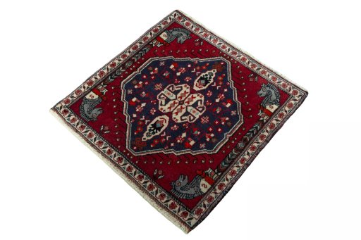 Corner detail of 2000s Shiraz rug showing border pattern and Wool pile