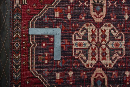 Backside of handmade 2000s Shiraz rug showing knot structure and weave density