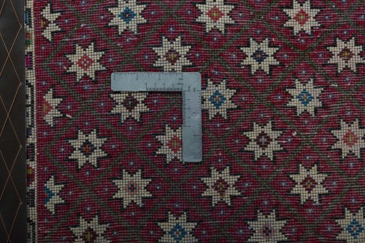 Backside of handmade 2000s Shiraz rug showing knot structure and weave density