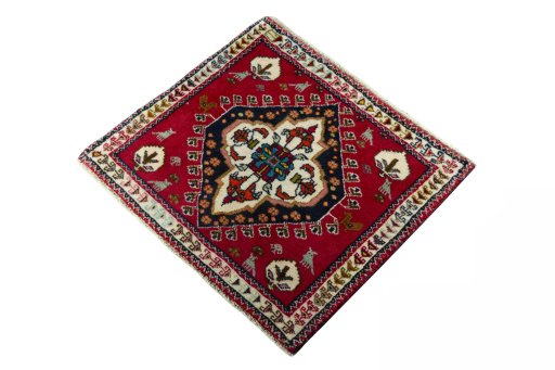 Corner detail of 2000s Shiraz rug showing border pattern and Wool pile