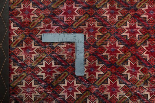 Backside of handmade 2000s Shiraz rug showing knot structure and weave density