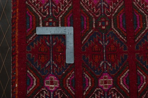 Backside of handmade 2000s Shiraz rug showing knot structure and weave density