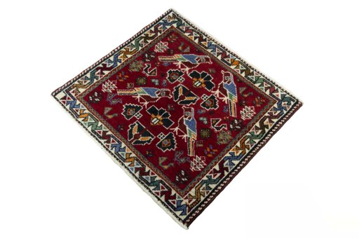 Corner detail of 2000s Shiraz rug showing border pattern and Wool pile