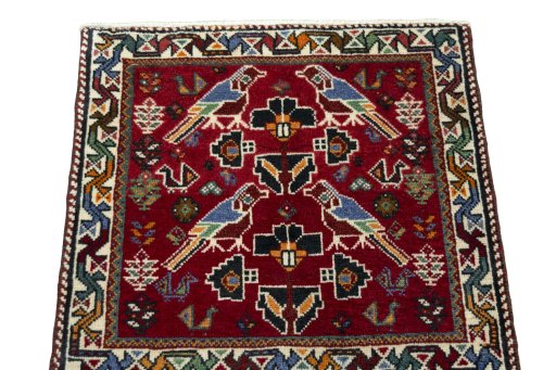 Surface texture of 2000s Shiraz rug with natural Wool and intricate pattern