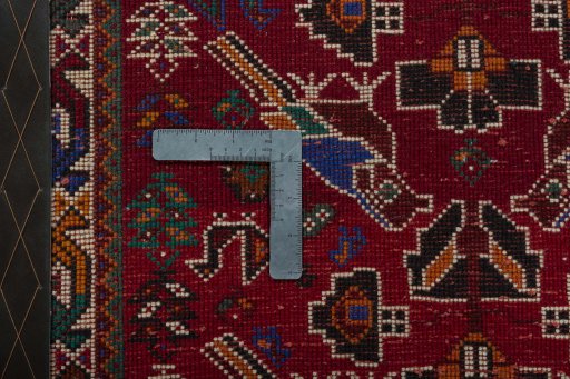 Backside of handmade 2000s Shiraz rug showing knot structure and weave density