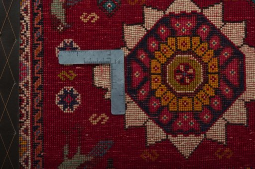 Backside of handmade 2000s Shiraz rug showing knot structure and weave density