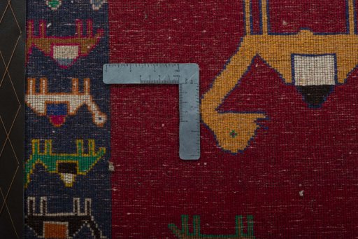 Backside of handmade 2000s Shiraz rug showing knot structure and weave density