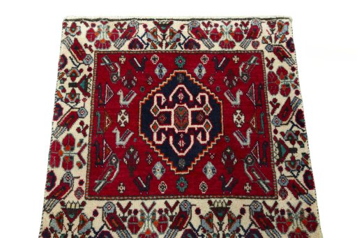 Surface texture of 2000s Shiraz rug with natural Wool and intricate pattern