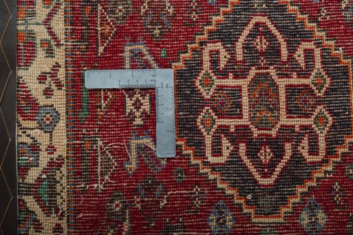 Backside of handmade 2000s Shiraz rug showing knot structure and weave density