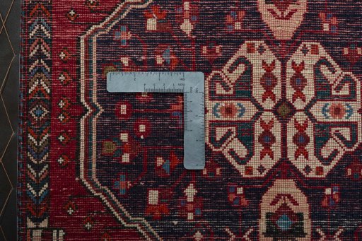 Backside of handmade 2000s Shiraz rug showing knot structure and weave density