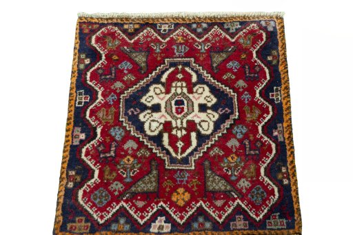 Surface texture of 2000s Shiraz rug with natural Wool and intricate pattern