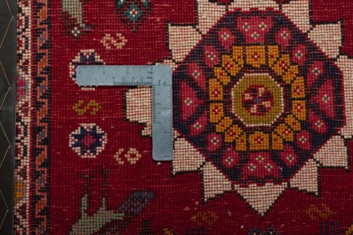 Backside of handmade 2000s Shiraz rug showing knot structure and weave density