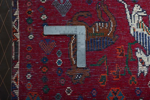 Backside of handmade 2000s Shiraz rug showing knot structure and weave density