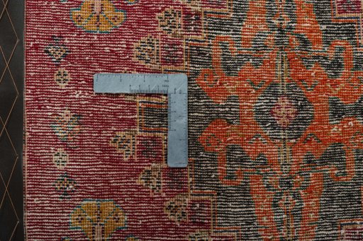 Backside of handmade 2000s Shiraz rug showing knot structure and weave density