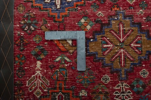 Backside of handmade 2000s Shiraz rug showing knot structure and weave density